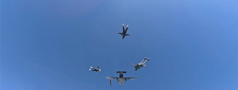 Skydivers jumping from a plane